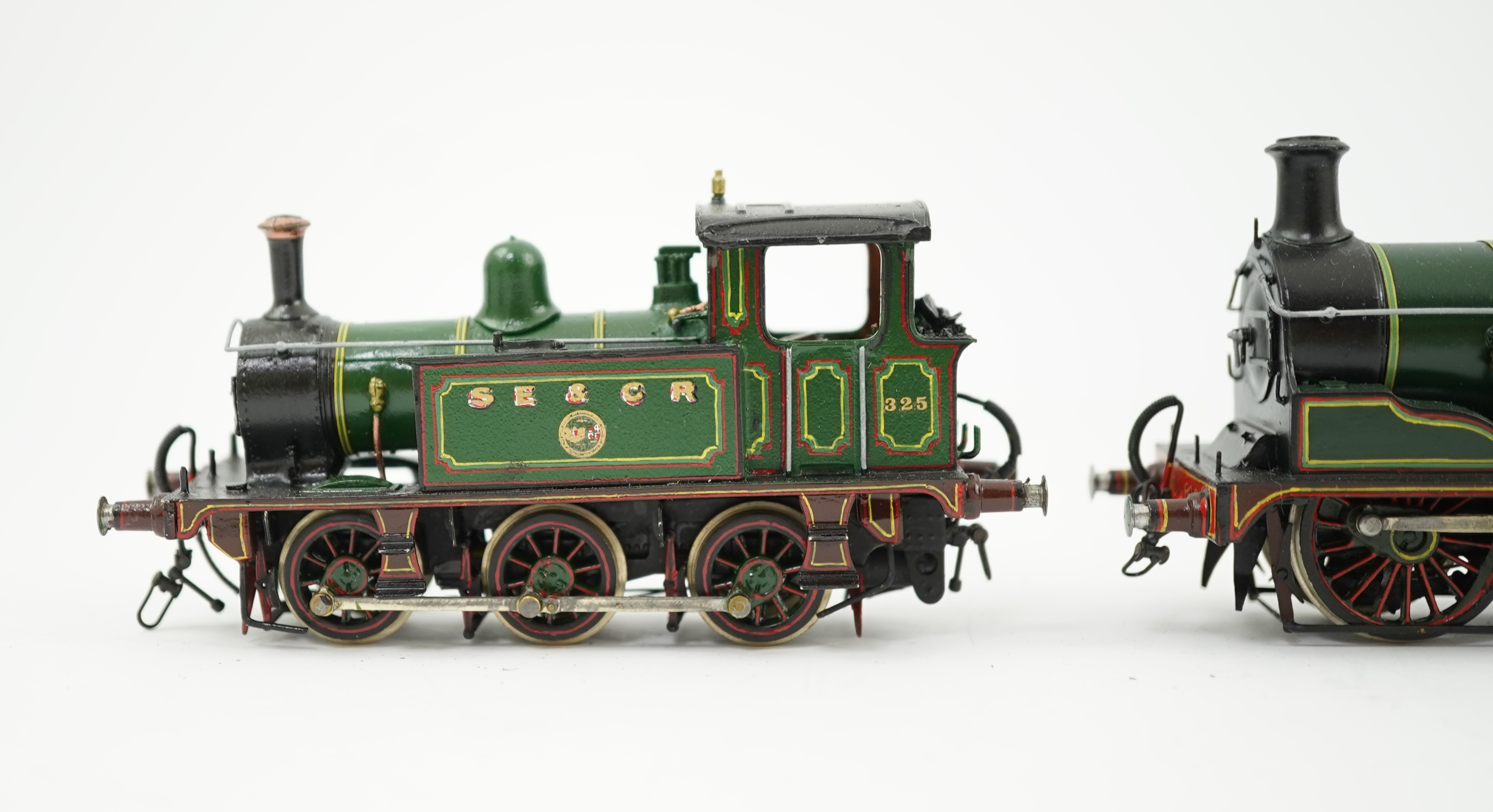 Three 00 gauge brass and white metal kit built Wainwright designed SE&CR tank locomotives (possibly by Wills Finecast); a class R1 0-4-4T, 696, a class H 0-4-4T, 263, and a class P 0-6-0T, 325, constructed, all painted a